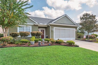 View of front of house with a front yard and a garage | Image 2