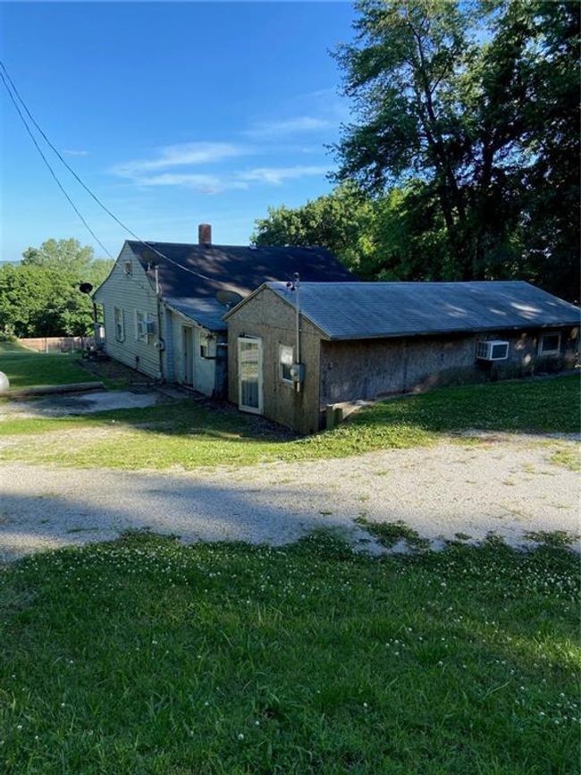 View of side of property featuring a chimney and a lawn | Image 12