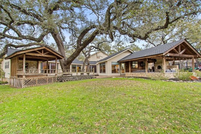 Back of house with a deck and a yard | Image 33