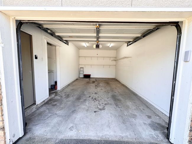 Garage with a garage door opener | Image 17