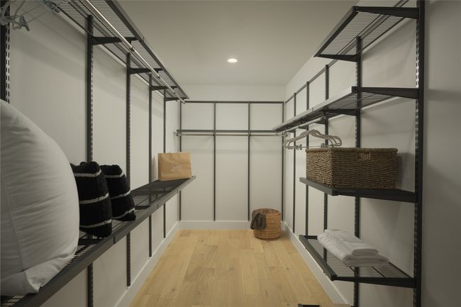 Walk in closet featuring light wood-style flooring | Image 13