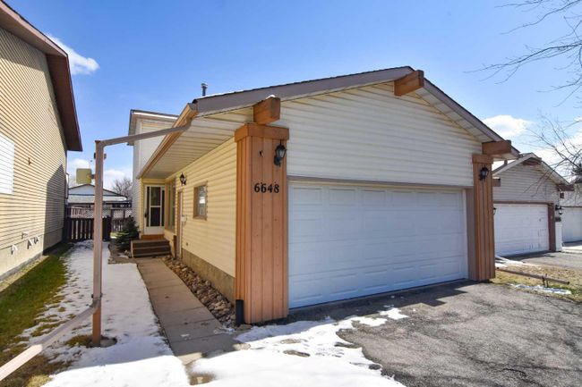 6648 Ranchview Drive Nw, Home with 3 bedrooms, 2 bathrooms and 4 parking in Calgary AB | Image 1