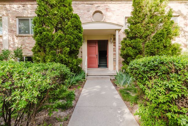 View of exterior entry featuring brick siding | Image 18