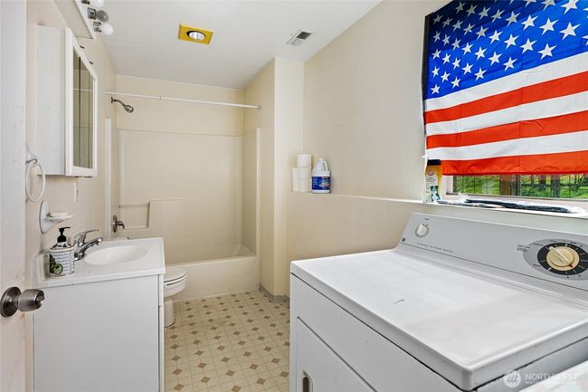 Full bathroom and laundry area in shop | Image 35