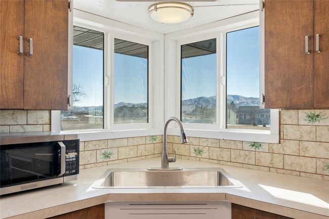 Charming vintage-style kitchen with solid wood cabinetry. | Image 36