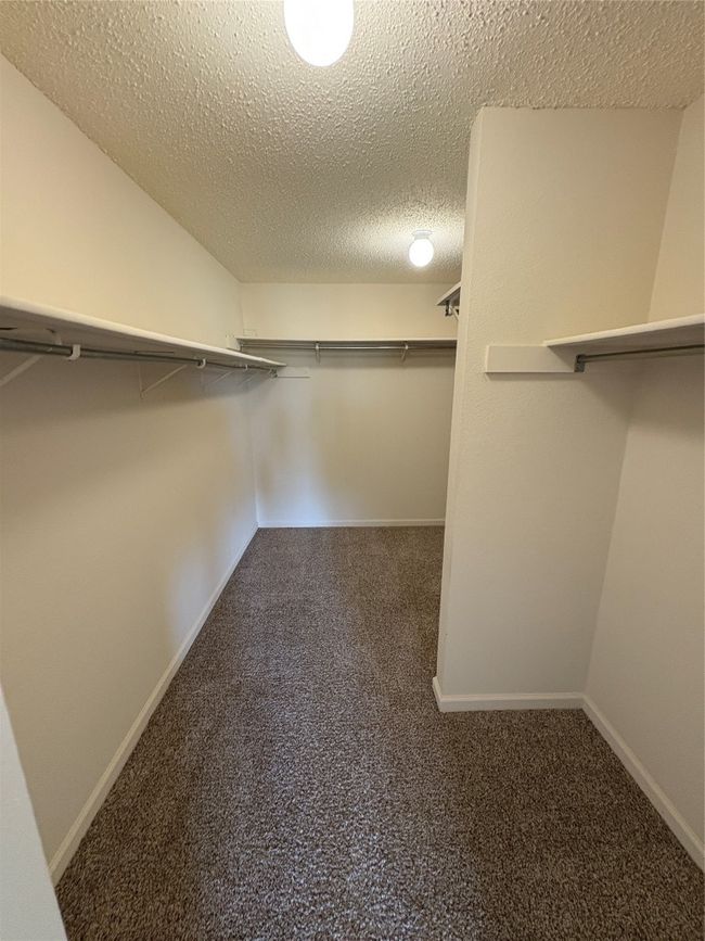 View of walk in closet | Image 13