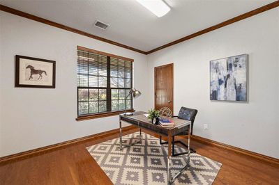 Office featuring crown molding, a textured ceiling, and dark hardwood / wood-style floors | Image 3