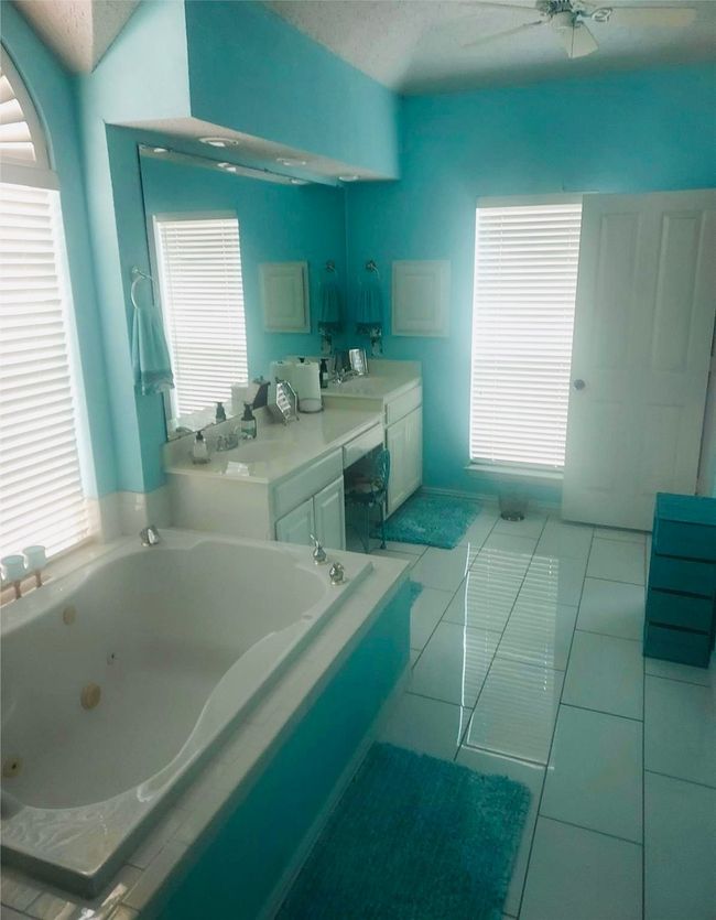 Full bath with Walk-In shower, jetted garden tub, beautiful tile floors, vanity and plenty of storage. | Image 27