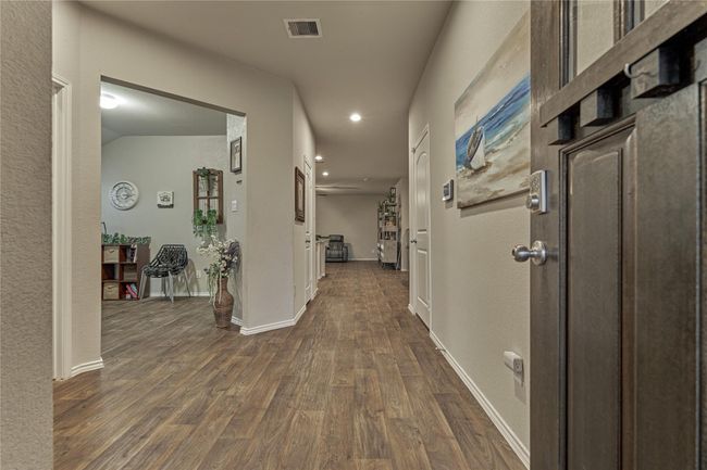 Upon entering you will notice the luxury vinyl plank flooring found all throughout the main living areas of the home. | Image 7