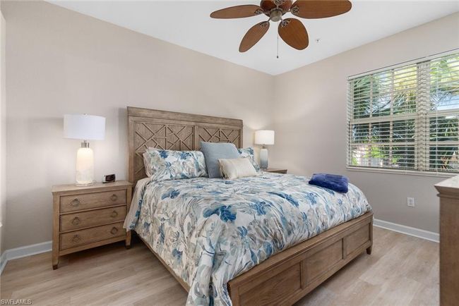 Bedroom with ceiling fan and light hardwood / wood-style floors | Image 10