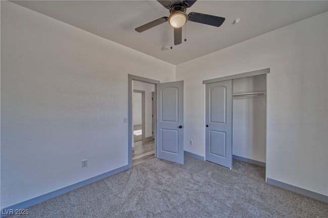 Another view of the guest bedroom, highlighting easy access to the hallway and seamless flow throughout the home. | Image 11