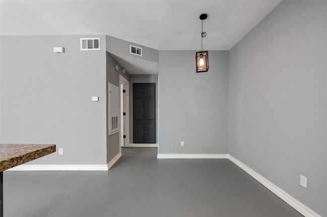 Dining area, concrete flooring, and baseboards throughout | Image 11