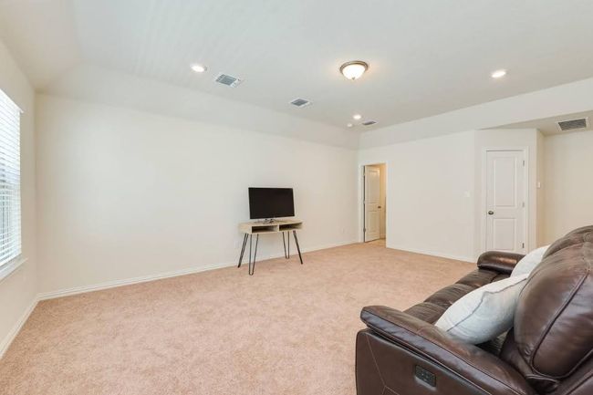 Living area with light carpet, plenty of natural light, baseboards, and recessed lighting | Image 28