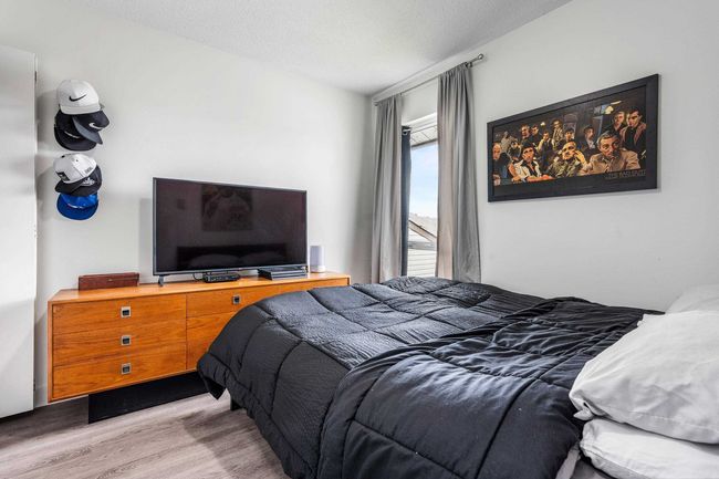 Bedroom featuring wood finished floors | Image 21