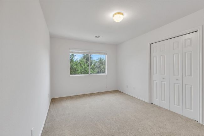 Unfurnished bedroom with carpet floors and a closet | Image 13