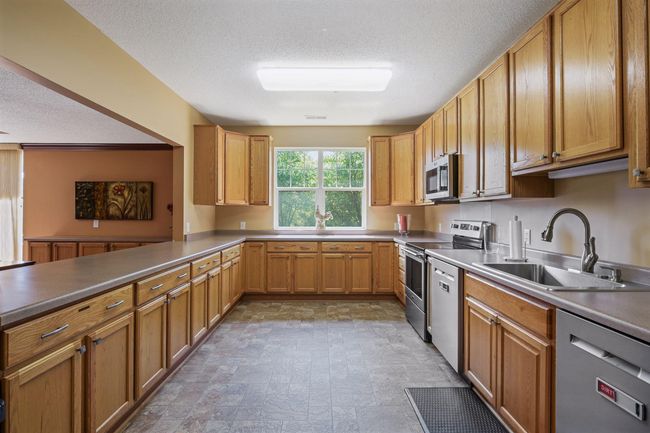 The Ridge Room's fully equipped kitchen is perfect for hosting large events, offering all the tools and appliances needed to make every gathering seamless and enjoyable. | Image 27