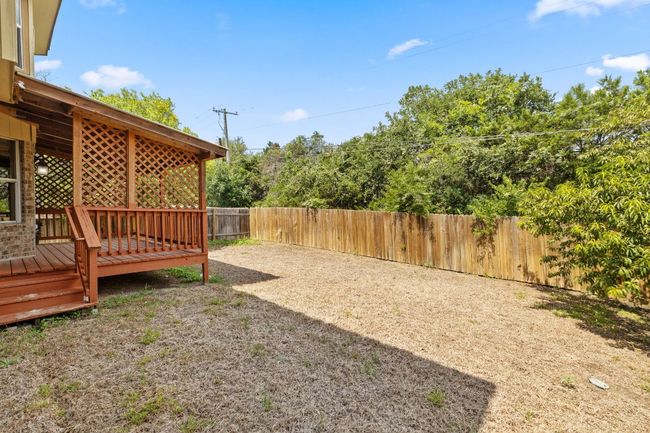 Fenced backyard featuring a deck | Image 33