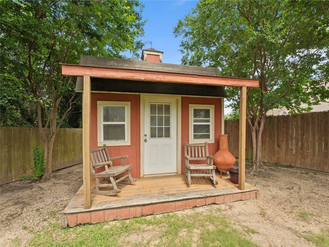 View of outbuilding featuring a fenced backyard | Image 23