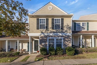 Lovely townhome in Providencetown. Covered entry leads into a spacious, beautiful floorplan. You’ll be amazed at the sizes of these rooms! Laminate flooring throughout the first floor. Patio and 2 designated parking spaces at rear. | Image 1