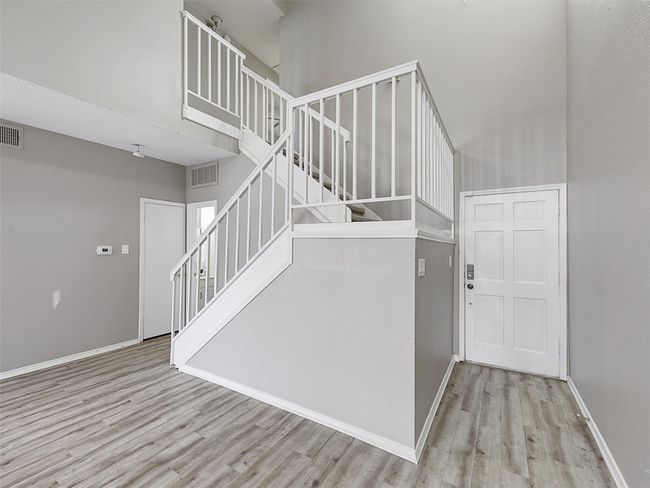 Stairway featuring wood finished floors, visible vents, and baseboards | Image 13