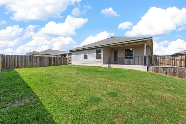 Back of house with a patio and a fenced​​‌​​​​‌​​‌‌​‌‌​​​‌‌​​‌‌​‌​​​​​‌ backyard | Image 31