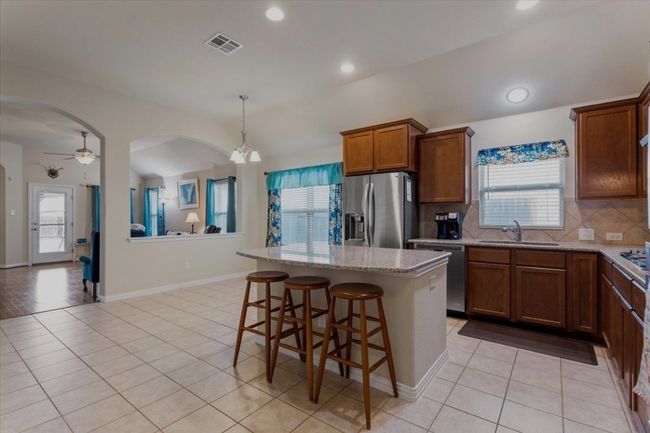 Kitchen has room for all your guests to gather. | Image 6