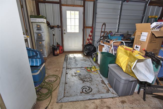 garage has an in ground tornado shelter | Image 41