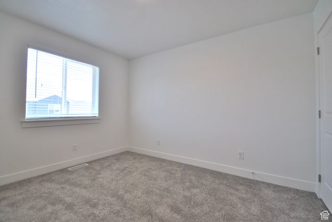 Bedroom featuring carpet floors and baseboards | Image 11