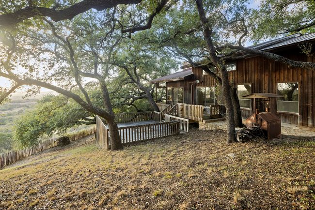View of yard with a wooden deck | Image 12