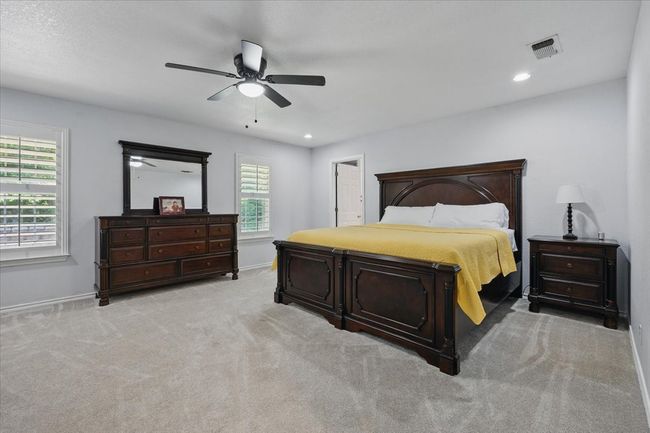 Bedroom featuring baseboards, carpet floors, recessed lighting, and a ceiling fan | Image 15