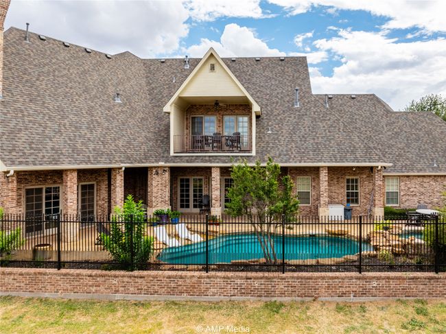 View of swimming pool with a patio | Image 38