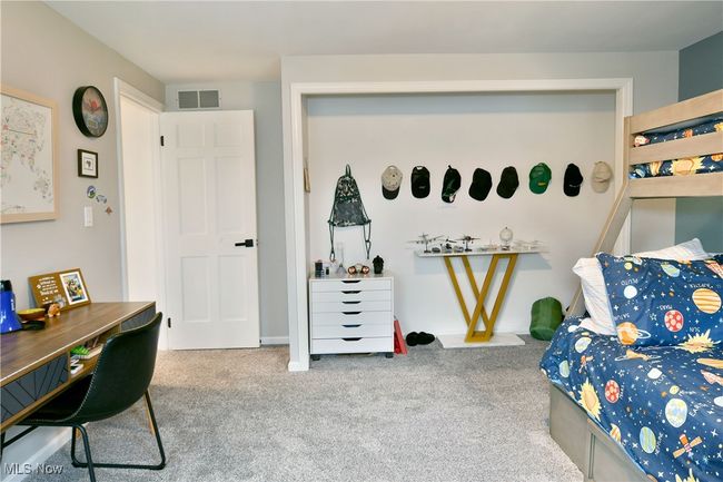 Bedroom with visible vents and carpet floors | Image 40