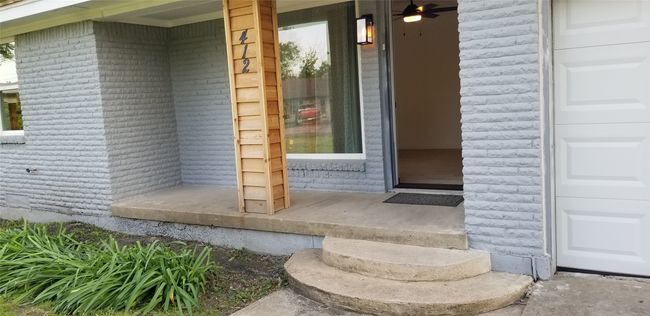 Entrance to property featuring a covered porch | Image 34