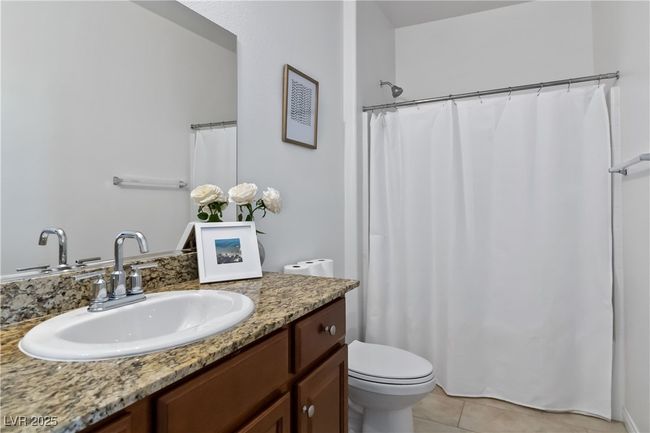 Full bathroom featuring vanity, toilet, and tile patterned floors | Image 30