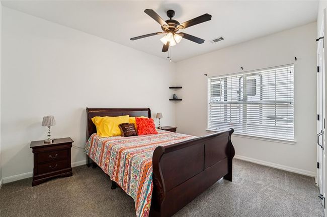 A secondary bedroom with ensuite bathroom is also located on the 1st floor. | Image 24