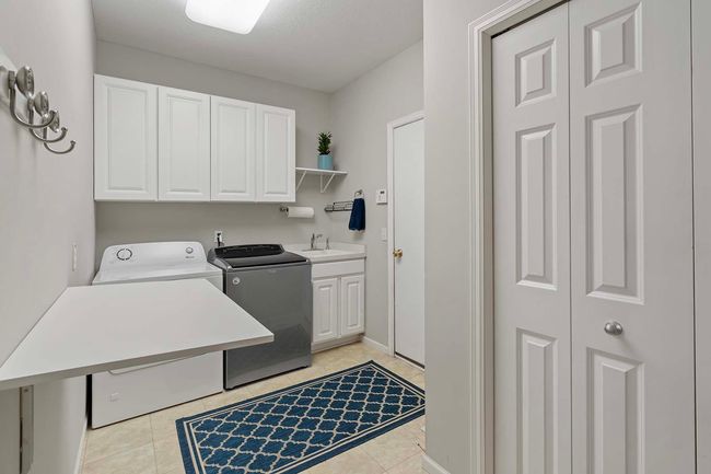 Handy folding table can be raised as needed. | Image 16