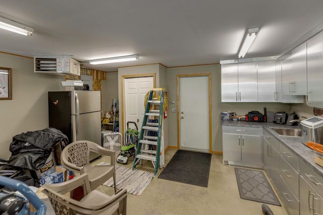 Stainless Cabinets & Shelving in Garage for Added Entertaining Area. | Image 50