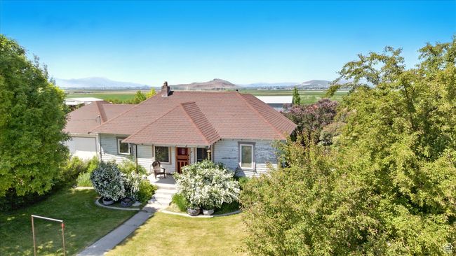 View of front of property with a front lawn, a chimney, and a mountain view | Image 23