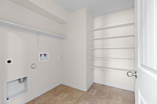 Laundry area featuring washer hookup, hookup for a gas dryer, electric dryer hookup, and baseboards | Image 13