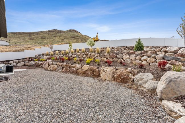 View of yard featuring fence, central AC unit, and a mountain view | Image 61