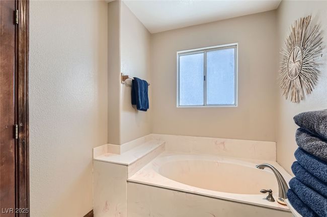 Full bath featuring a garden tub | Image 19