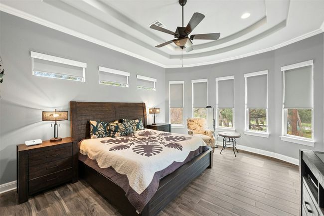 Primary suite is all windows with custom treatments. | Image 21