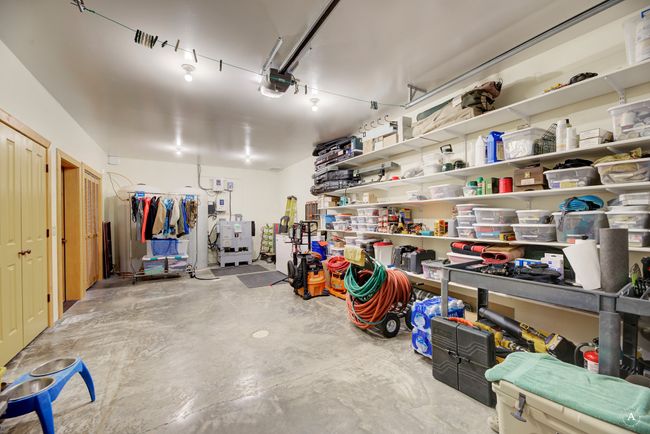 Garage featuring a garage door opener | Image 55