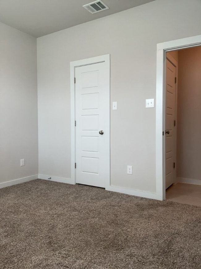 Empty room featuring light carpet and baseboards | Image 27