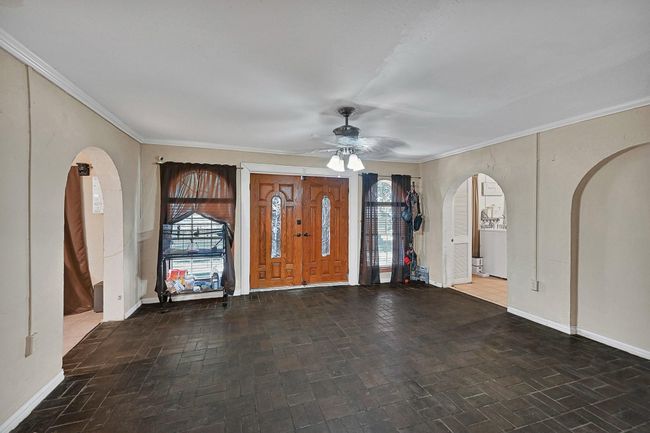 Double doors and large entrance, kitchen to right and living room to the left | Image 4