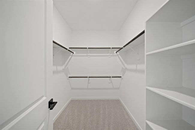 Primary suite walk-in closet (*Photo not of actual home and used for illustration purposes only.) | Image 14