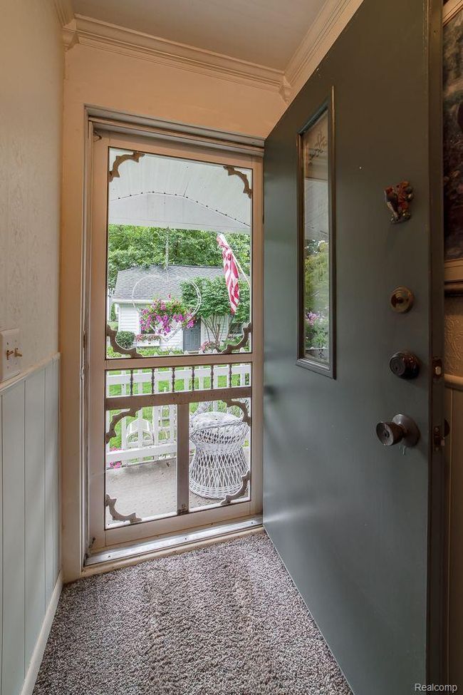 Door to porch overlooking the front yard | Image 39
