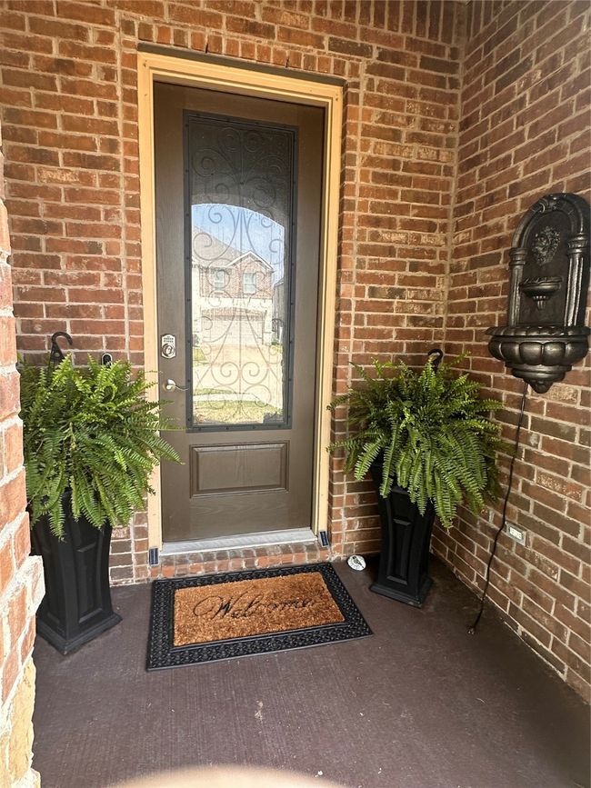 Entrance to property featuring brick siding | Image 4
