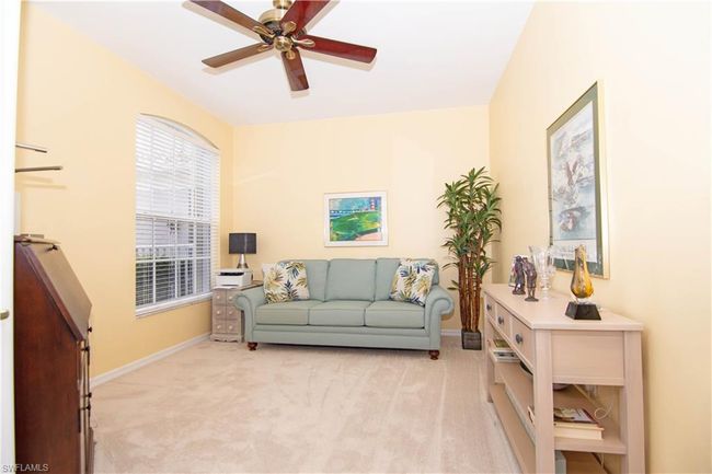 Den with french doors offers flexibility and can function as a home office or an additional space for guests. | Image 22