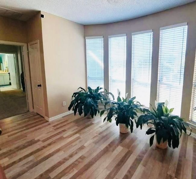 Beautiful big windows welcome tons of natural light throughout the home. | Image 14